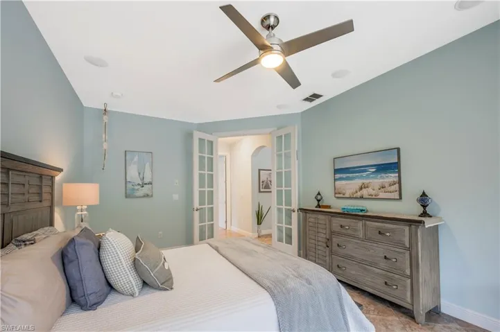 Bedroom with baseboards and a ceiling fan