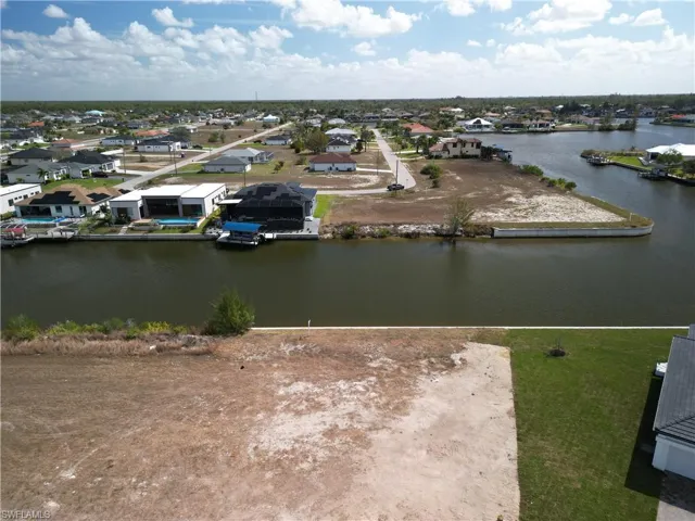 Aerial view of residential area with a nearby body of water