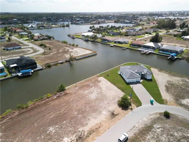 Aerial overview of property's location with nearby suburban area and a large body of water