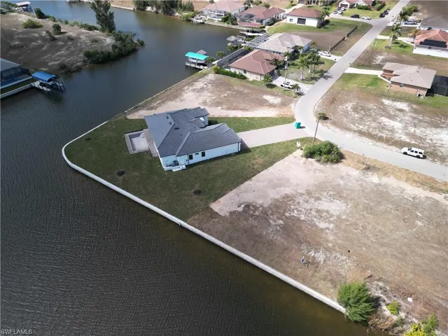 Aerial overview of property's location featuring a large body of water