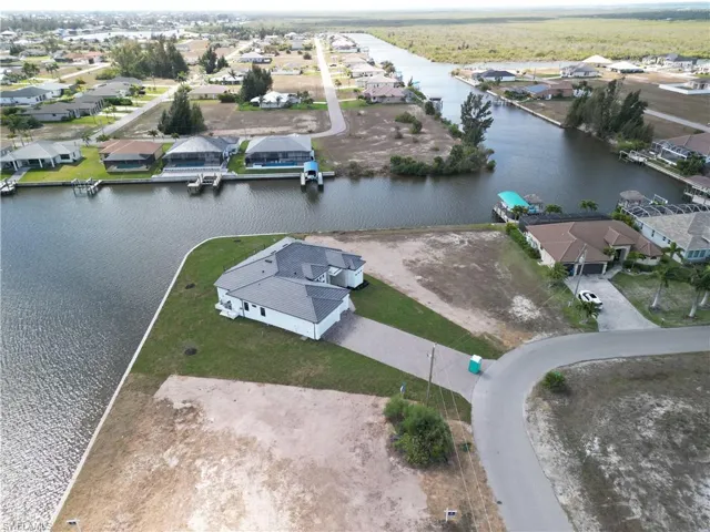 Aerial view of residential area with a nearby body of water