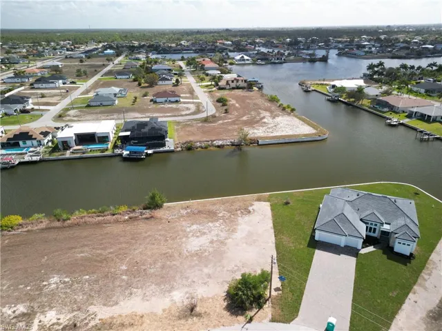 Aerial perspective of suburban area with a nearby body of water