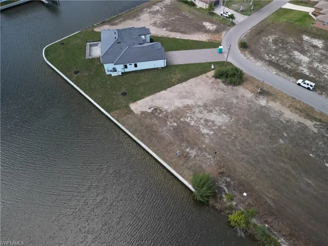 View of subject property featuring a large body of water