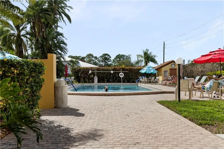 Community pool featuring a patio
