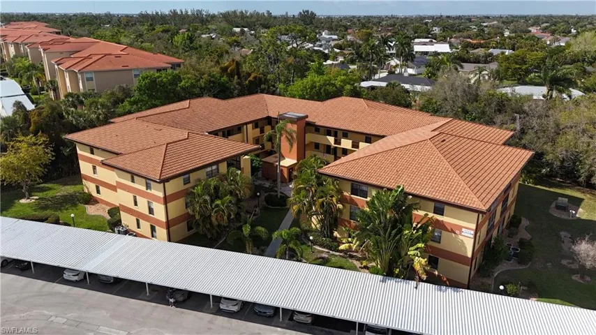 Aerial view of residential area with a tree filled landscape