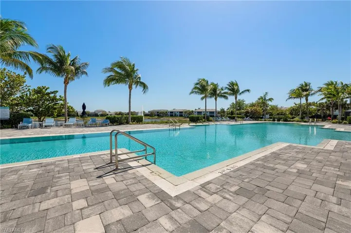 Community pool with a patio area