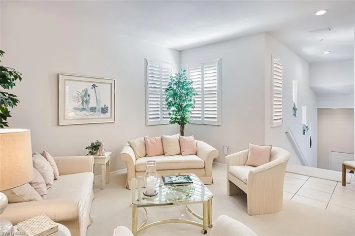 Living room featuring carpet flooring and recessed lighting