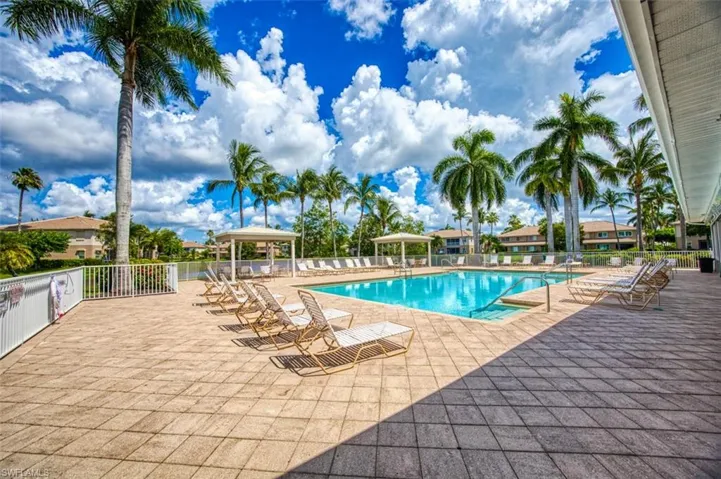 Community pool with a patio area and a gazebo