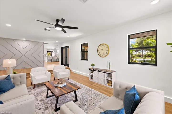 The Formal Living Room is just off the Main Entry & has LED Lighted Baseboards