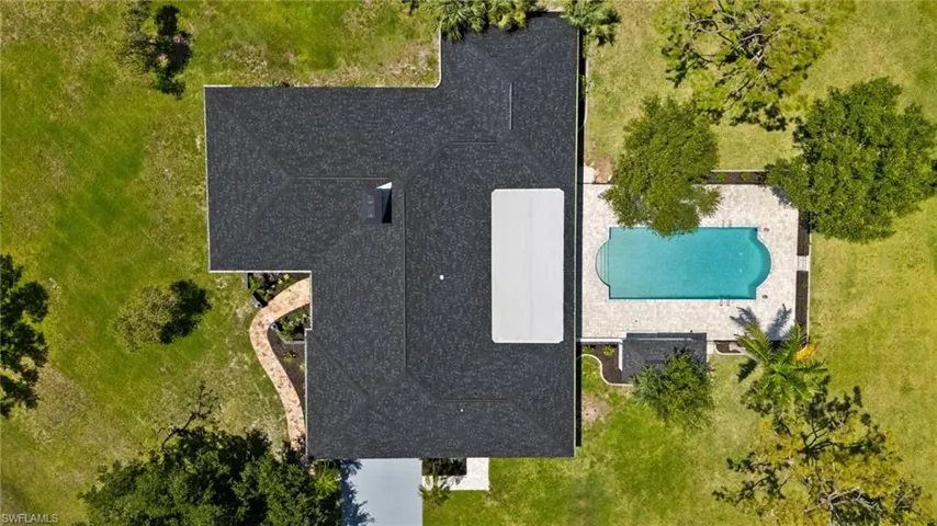 House is absolutely stunning and look how large that pool is.