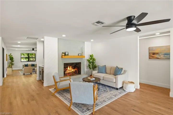 The New Family Room as a Real Brick Wood Burning Fireplace with a Smooth Coat stucco Finish