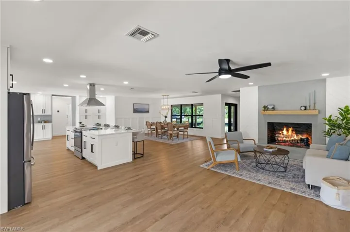 The Main Living is a true Open Concept with a Real Wood Burning Fireplace