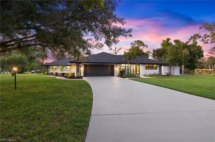 Home features a New Roof, New Impact Rated Garage Door, New Hurricane Impact Windows