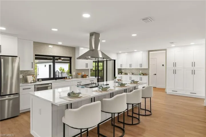 The New Kitchen features Quartz Counters including an over 121" Island with Cabinets on both sides