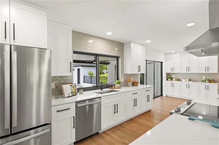 The New Kitchen features a New Impact Glass Sliding Windows which has a outdoor Quartz Counter