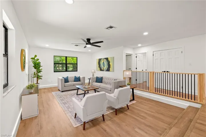 The Formal Living Room has a New Custom Railing, New Led Recess Lights a New Fan
