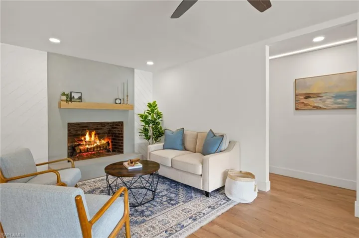 The New Family Room has New Recess Lights, a Fan, a New Wood Mantle and a New Hearth