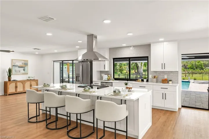The New Kitchen features Whirlpool S/S Appliances including a Sliding Range with functional Vent Hood