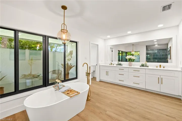 The Master Bathroom has a Free Standing Tub and over 100" Vanity with Dual Sinks