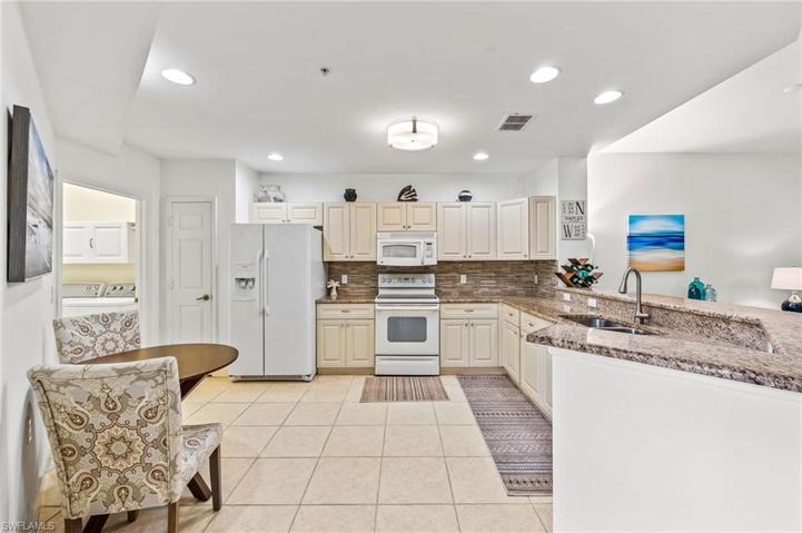 Beautiful granite counters and backsplash, new faucet, new garbage disposal, and updated cabinets.