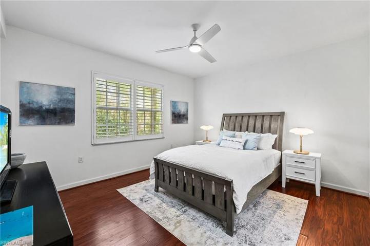 Sizable primary suite with a queen bed complemented by a large walk in closet.