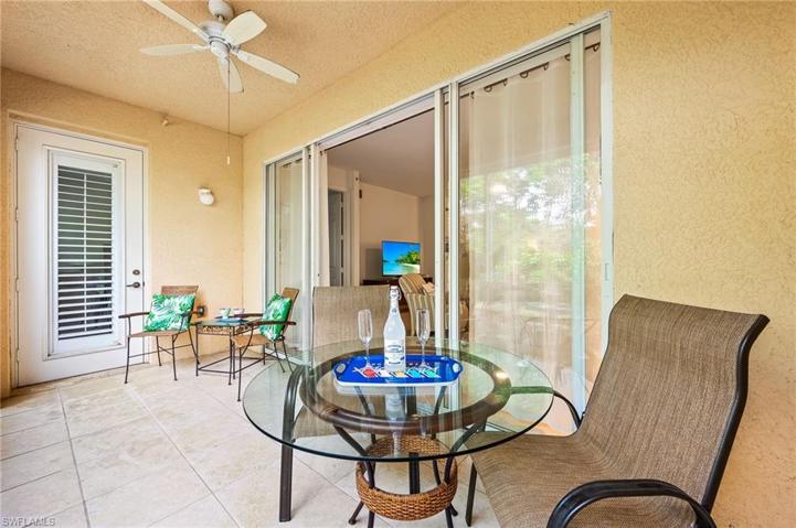 Large, private lanai facing beautiful, lush landscaping with direct access to walking trail and a lake.