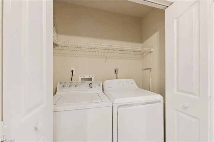 Laundry area with washing machine and clothes dryer