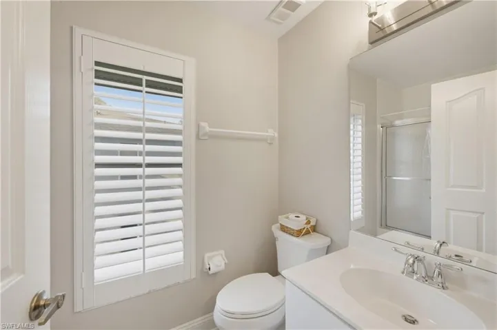 Full bathroom featuring vanity and a stall shower