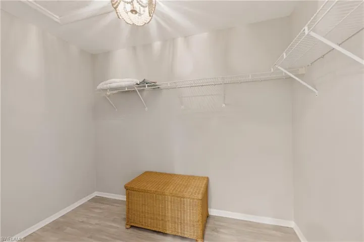 Walk in closet featuring light wood finished floors