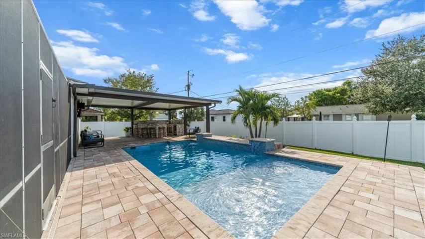 View of pool featuring a patio area and a fenced backyard