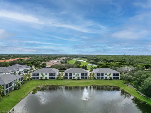 Aerial perspective of suburban area with a nearby body of water