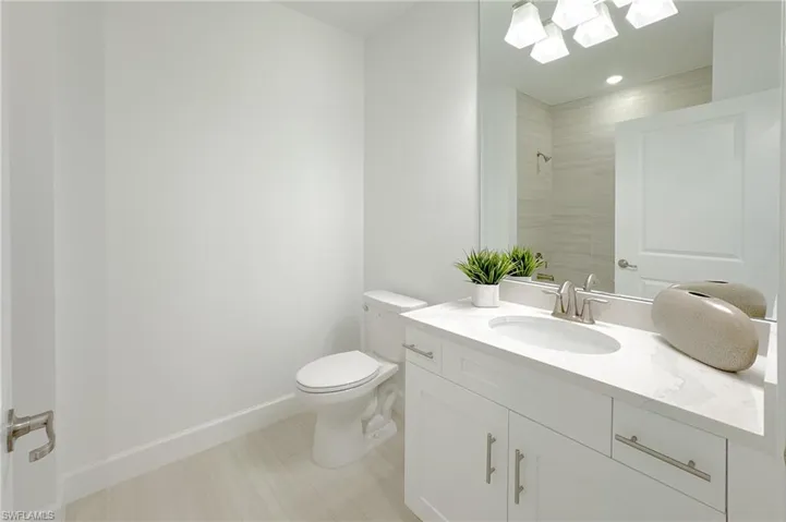 Full bathroom featuring vanity and tiled shower