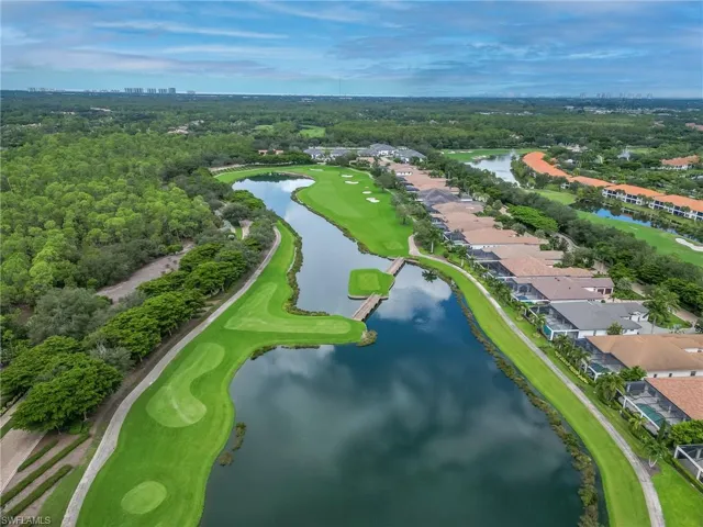 Bird's eye view of a golf course and a large body of water