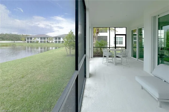 Unfurnished sunroom featuring a water view