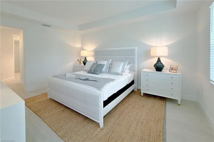 Bedroom with a raised ceiling