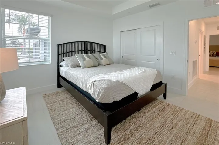 Bedroom featuring a closet and baseboards
