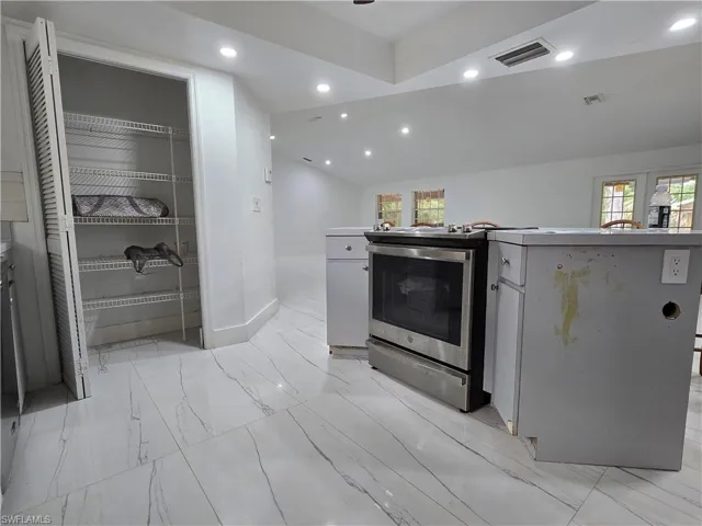 Kitchen featuring visible vents, recessed lighting, electric stove, and a healthy amount of sunlight