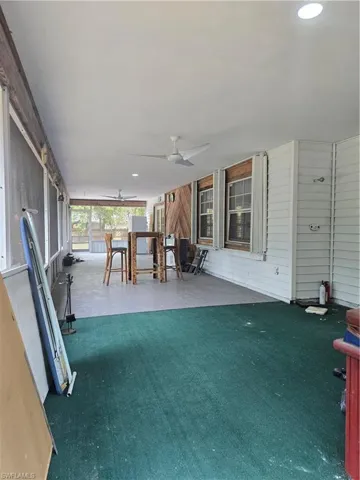 View of patio / terrace with outdoor dining area and ceiling fan