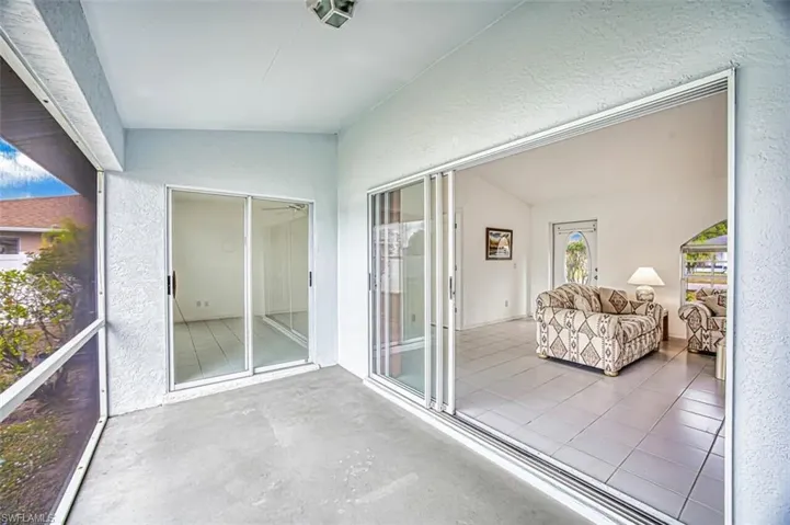 Lanai area with exit doors from primary bedroom and living area
