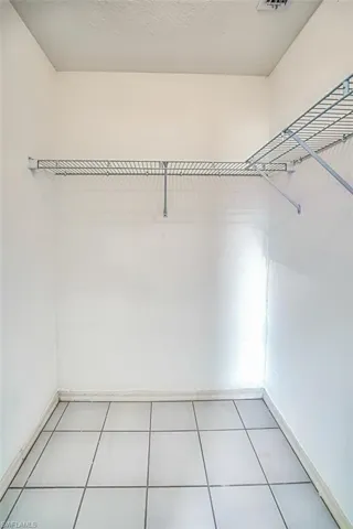 Walk in closet in primary bedroom