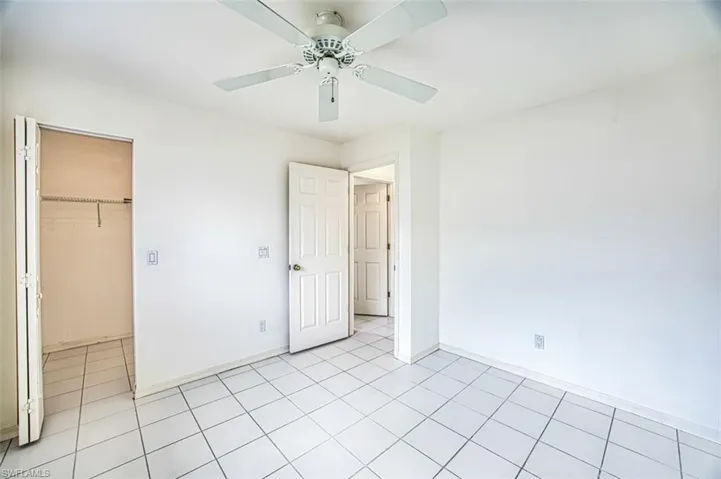 Guest bedroom with walk-in closet