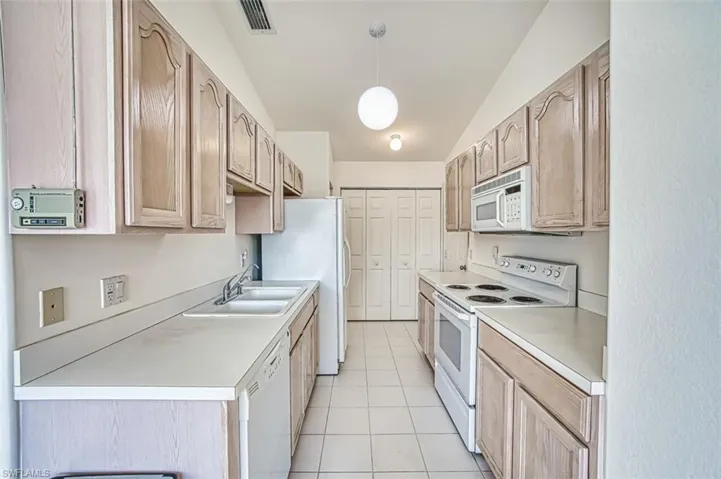 Kitchen with washer and dryer in the closet