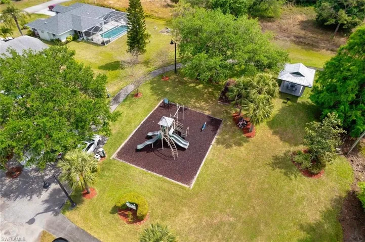 Aerial view of community playground with covered seating area