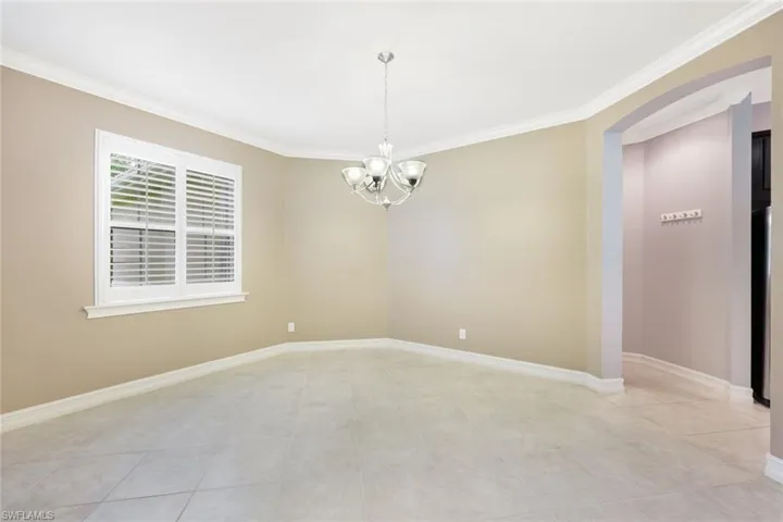 Formal dining room with crown molding