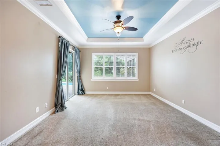 Master bedroom with sliders to the pool area