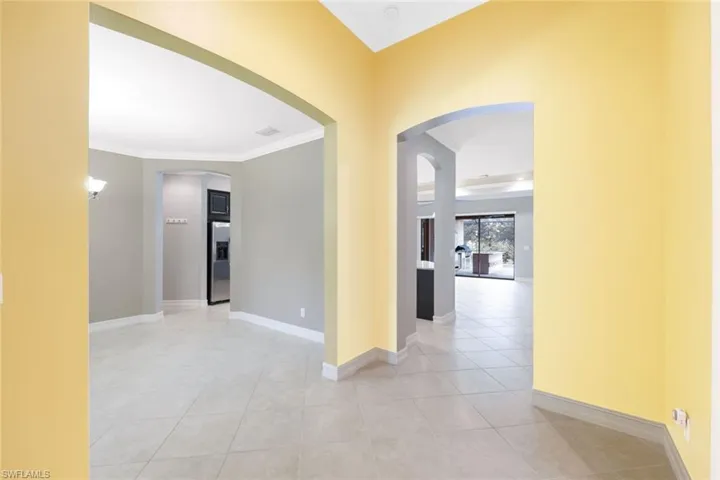 Double door entry with tiled foyer leading into your living area