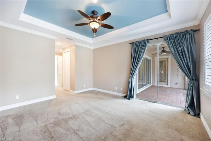 Large master bedroom with tray ceiling & crown molding