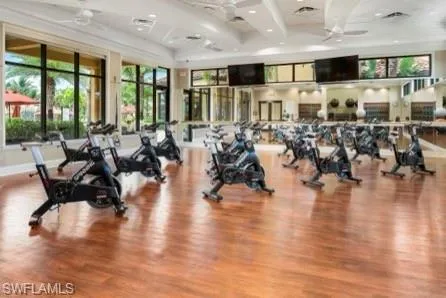 Exercise room featuring coffered ceiling and recessed lighting