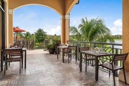 View of patio featuring outdoor dining area and a water view