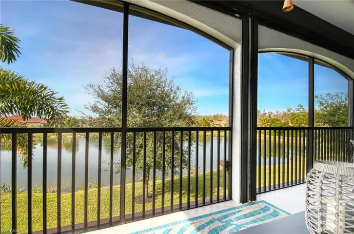 Sunroom with a water view
